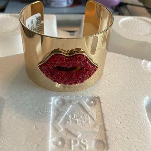 Gold cuff bracelet with lip crystal appliqué